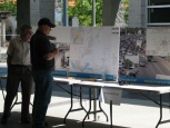 Picture of two men at a booth with posters about the General Plan.