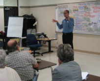 Planner presenting to an audience.